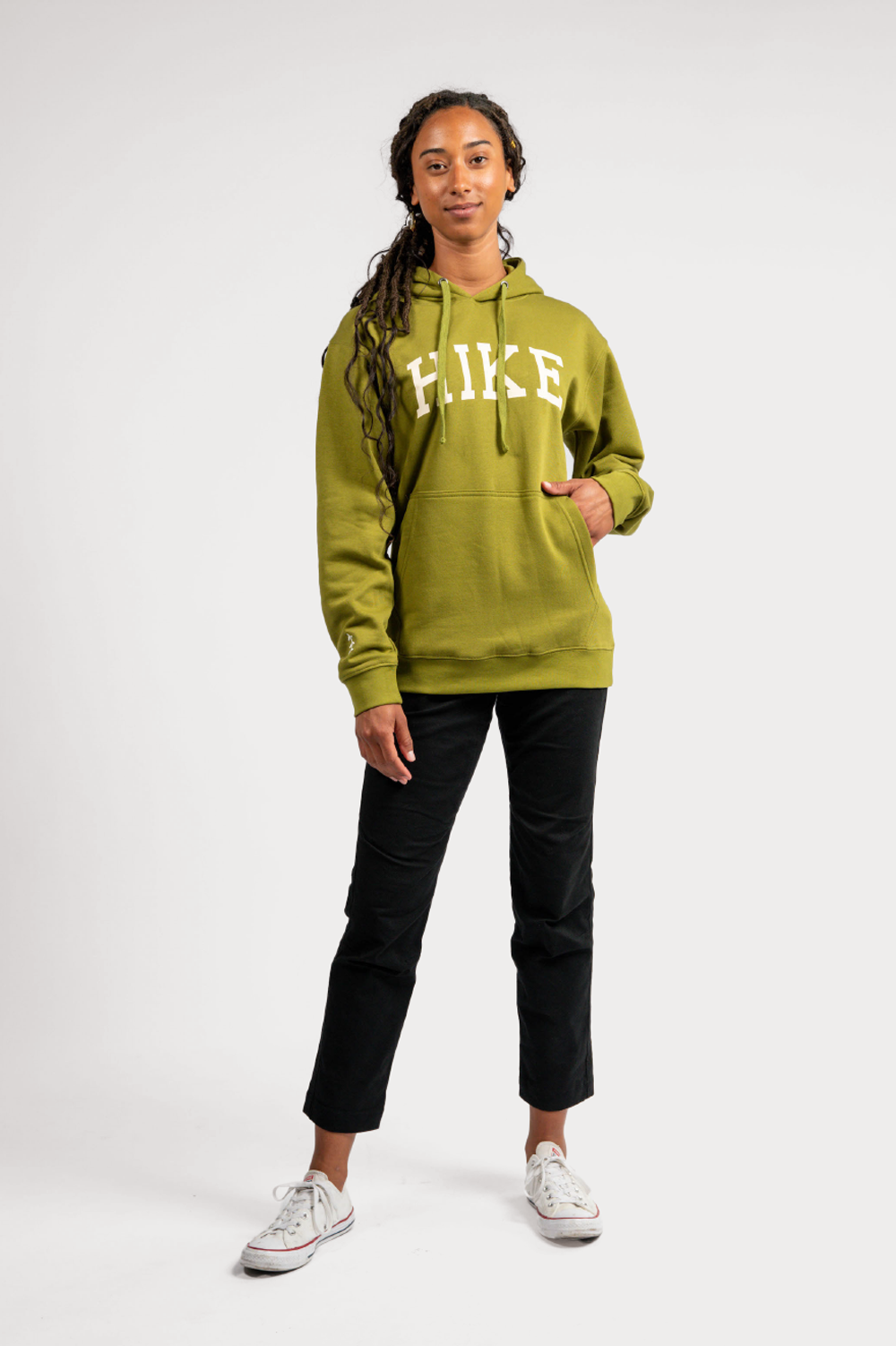 black woman in green pullover outdoor hoodie with pockets #color_matcha