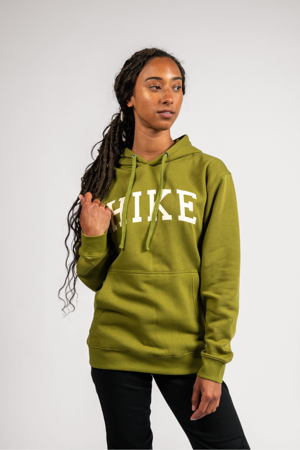 black woman in green pullover outdoor hoodie with pockets #color_matcha