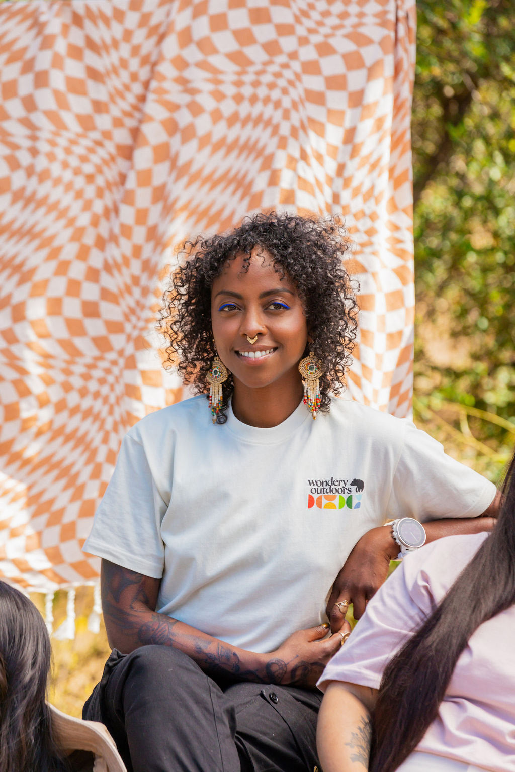 black BIPOC camping in mountains with lightweight t-shirt #color_dove