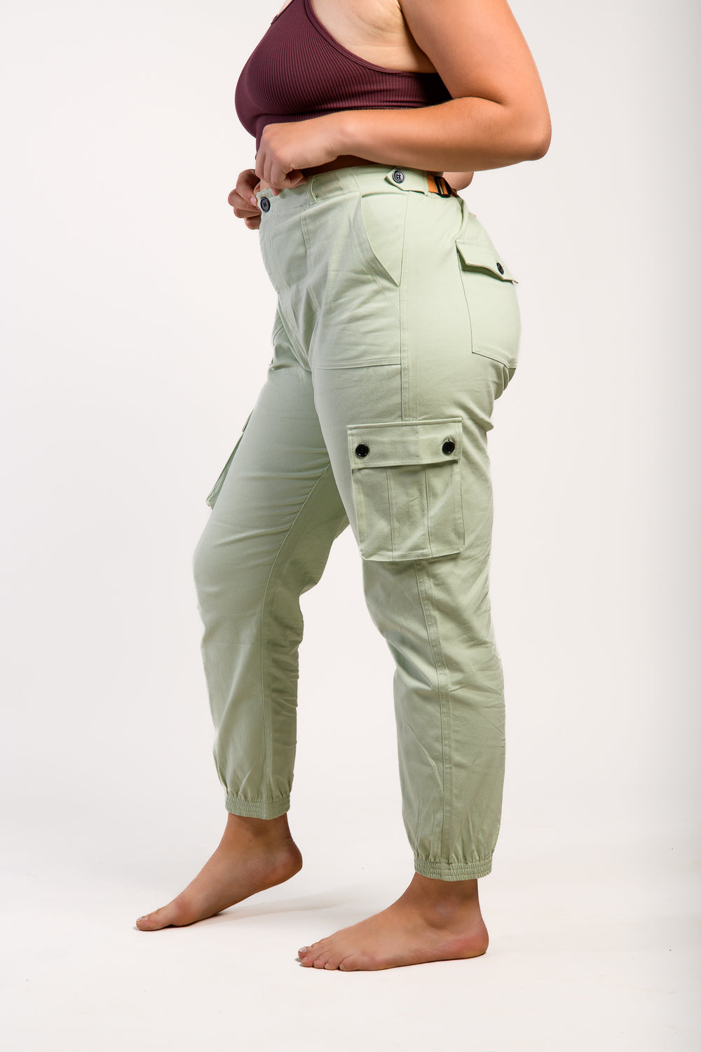 plus size tall woman in outdoor hiking pants and hiking boots #color_agave