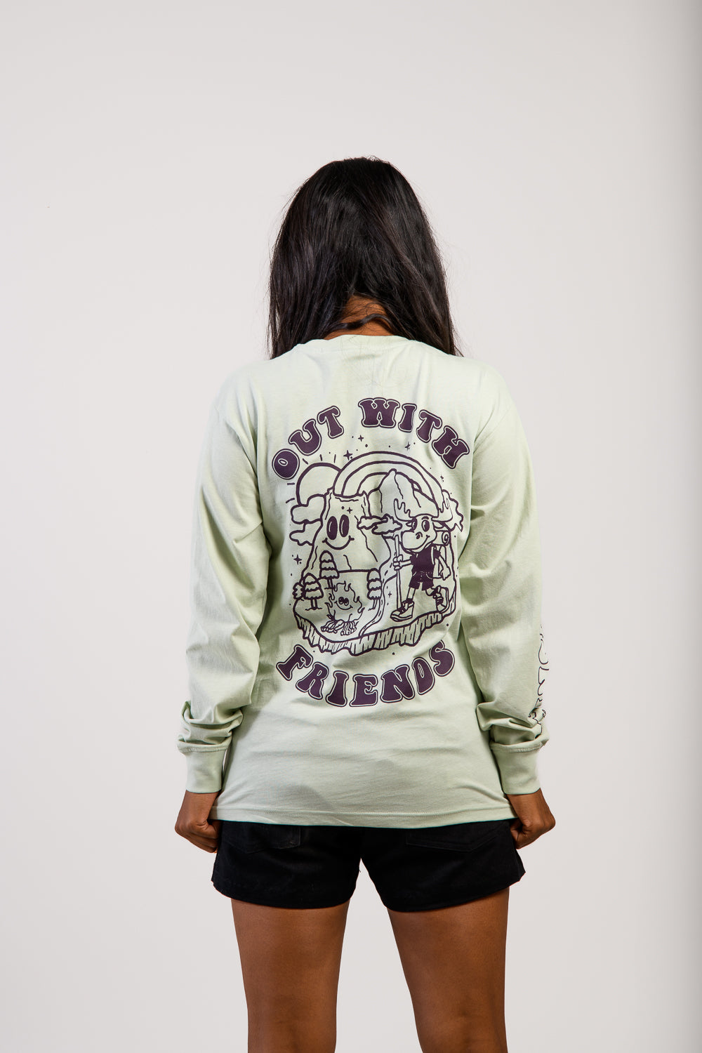 woman in adjustable brown cargo hiking pants and graphic camping t-shirt top #color_agave