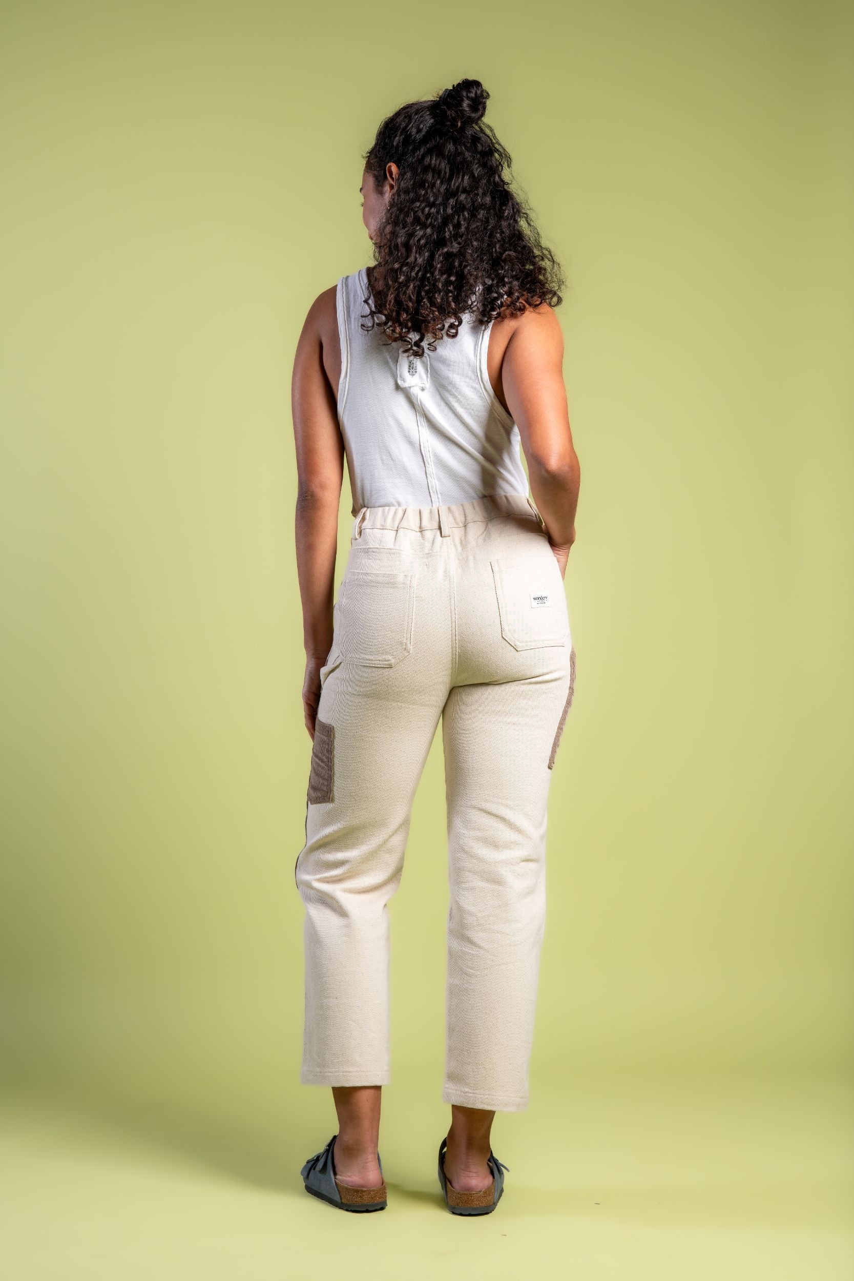 Woman in straight leg patchwork denim pants and Birkenstocks #color_cream