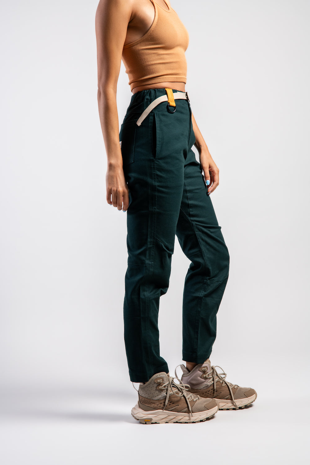Woman in casual straight leg pants and orange tank top #color_emerald
