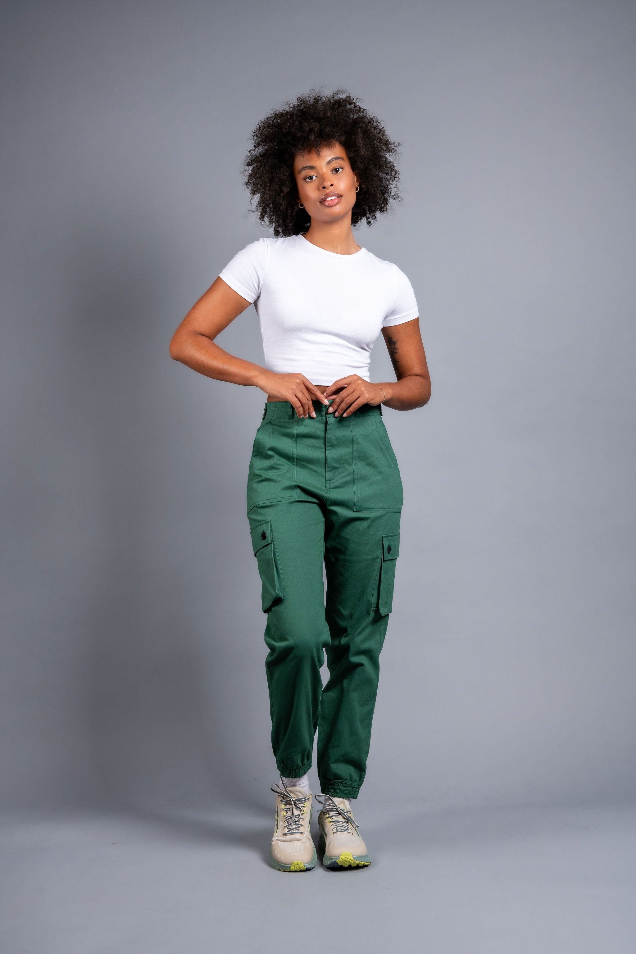 woman in adjustable green cargo hiking pants and tee shirt #color_sagebrush