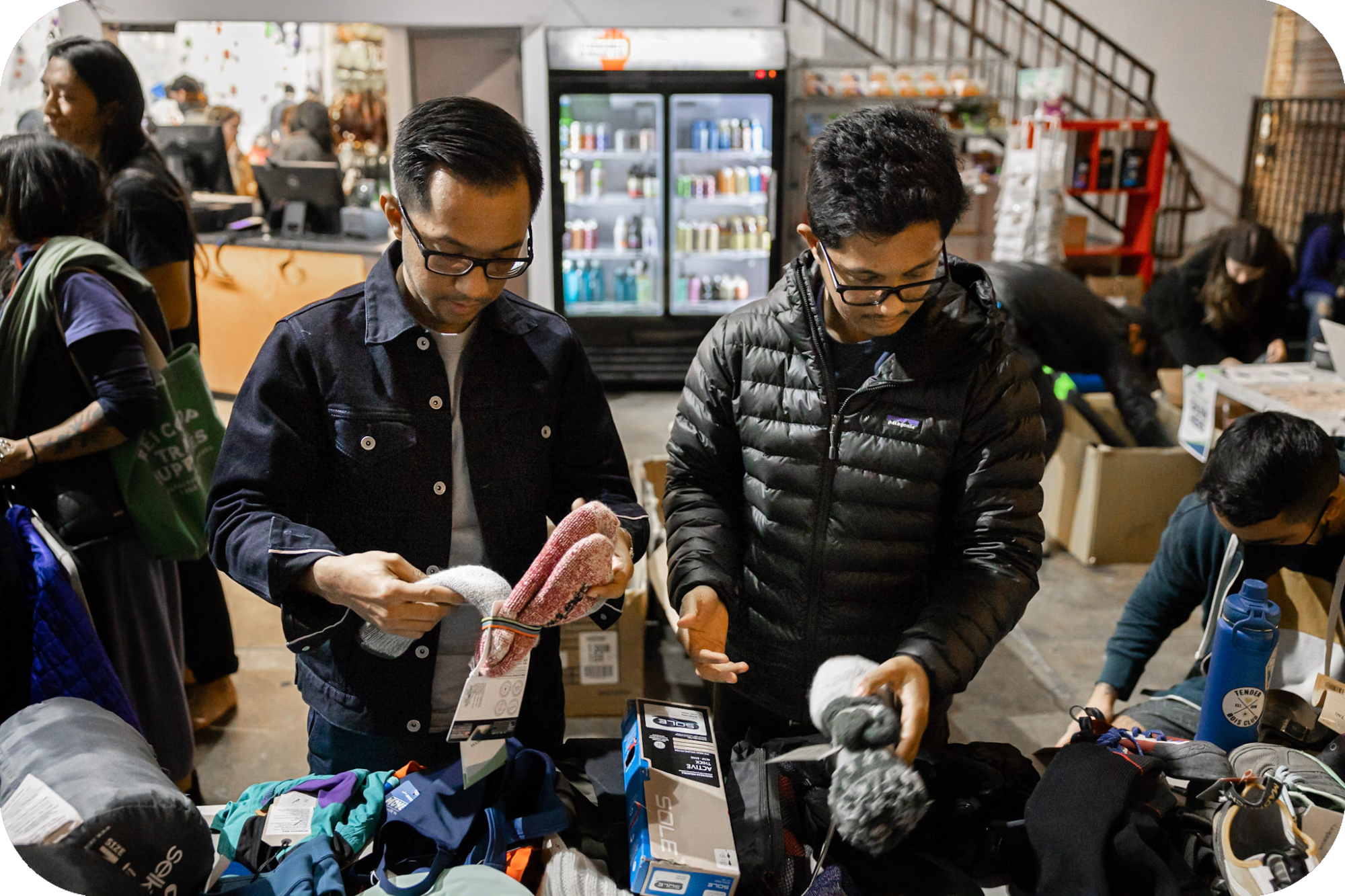 BIPOC men at a garage and bake sale at climbing gym