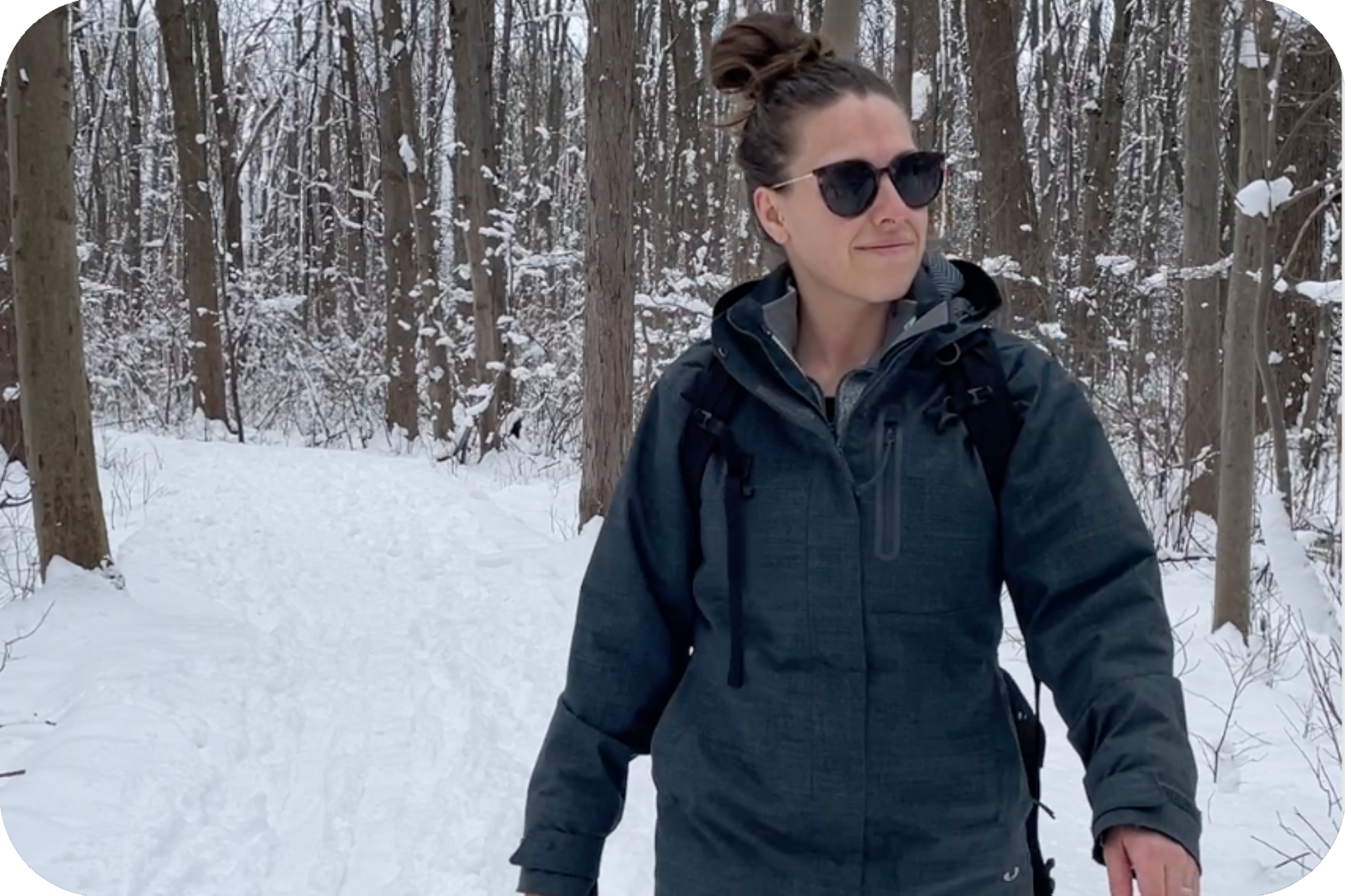 woman hiking in snow with snowshoes