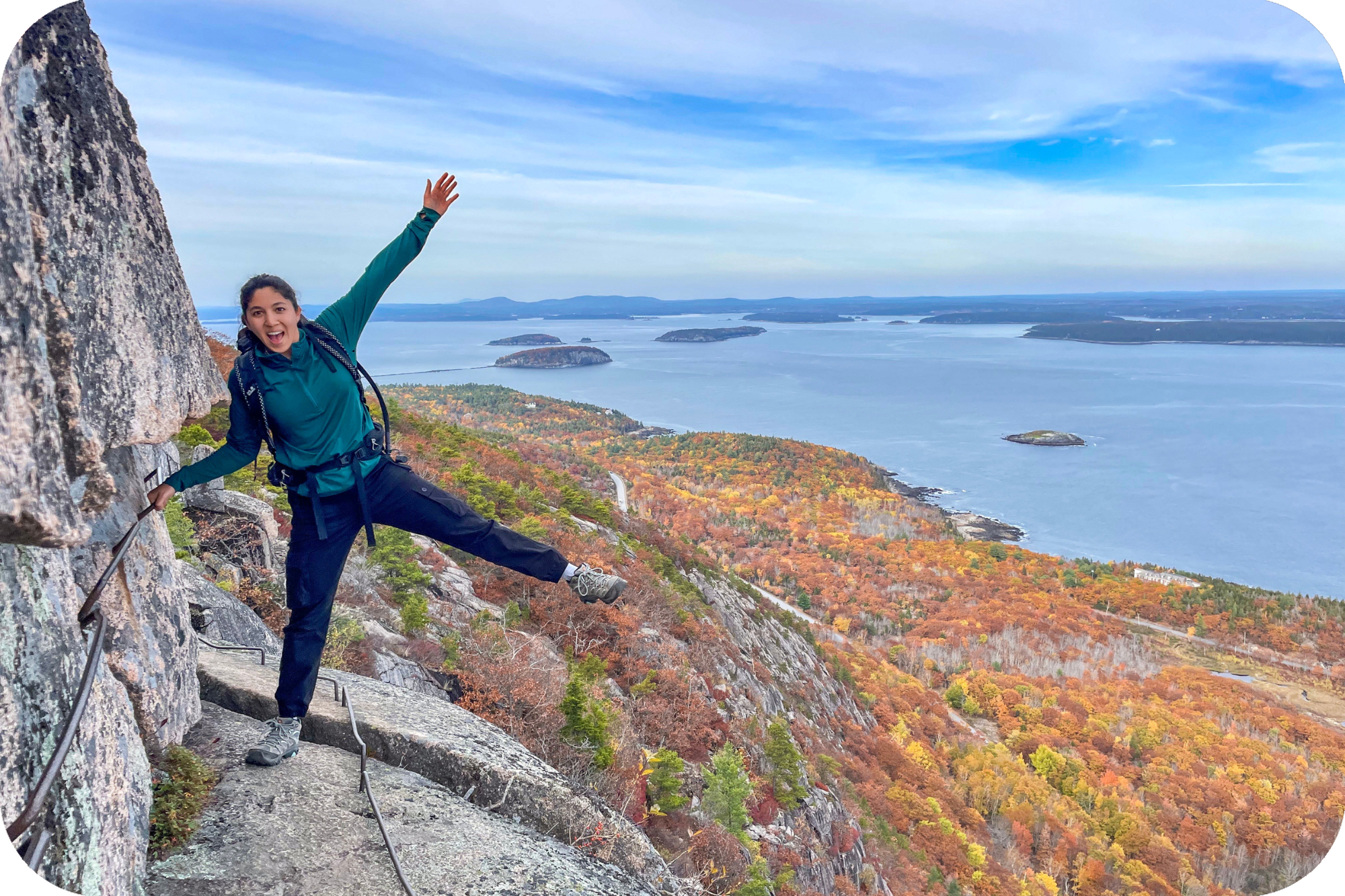 Woman hiking along rock trail with a view