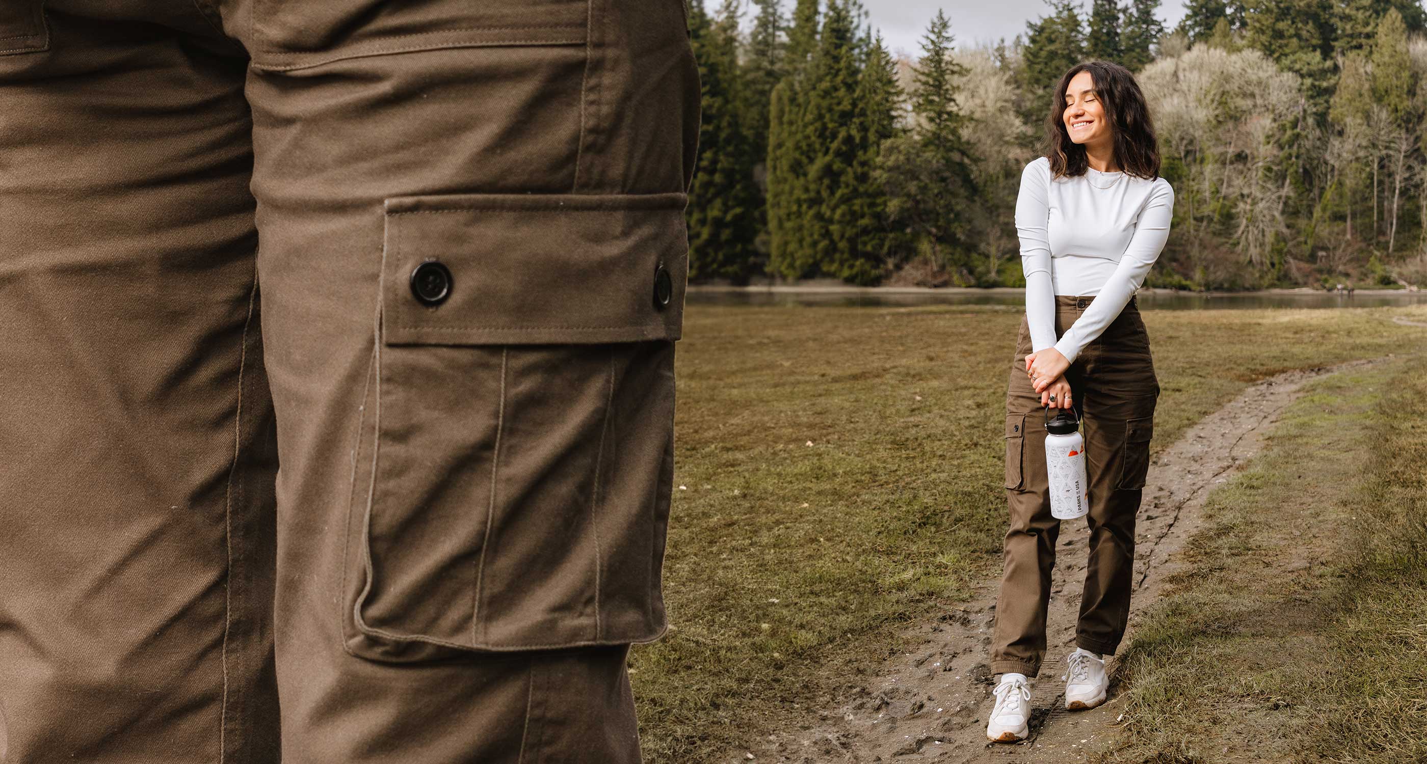 Brown cargo pant pocket on left and woman hiking in brown cargo pants and white travel water bottle
