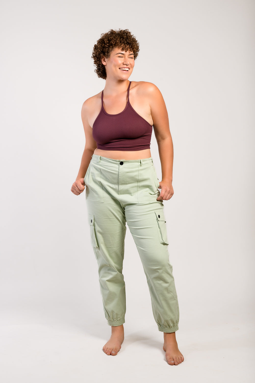 plus size tall woman in outdoor hiking pants and hiking boots #color_agave