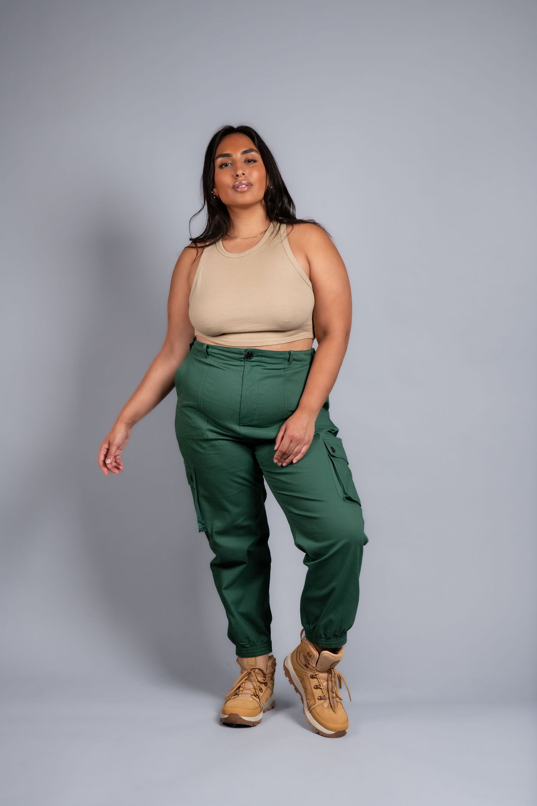 woman in adjustable green cargo hiking pants and tank top #color_sagebrush